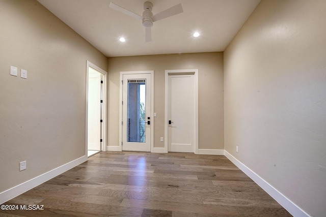 foyer entrance with ceiling fan and light hardwood / wood-style flooring