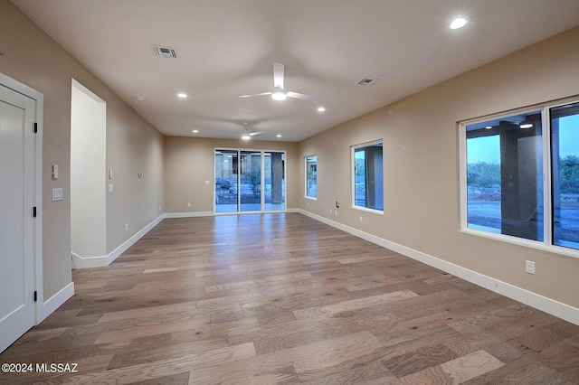 unfurnished room featuring ceiling fan and light hardwood / wood-style flooring