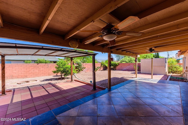 view of patio featuring ceiling fan