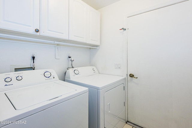 laundry area featuring cabinets and independent washer and dryer