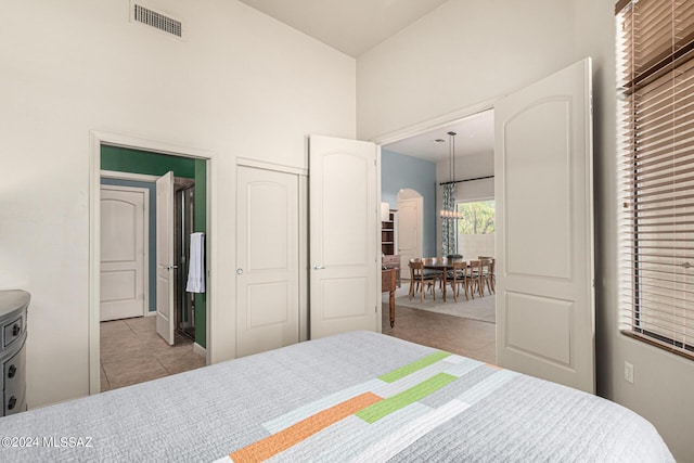 tiled bedroom featuring a closet