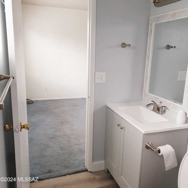 bathroom featuring vanity and a textured ceiling