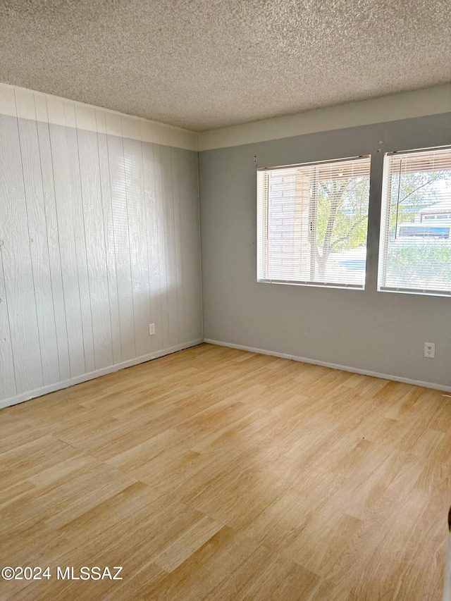 spare room with a textured ceiling