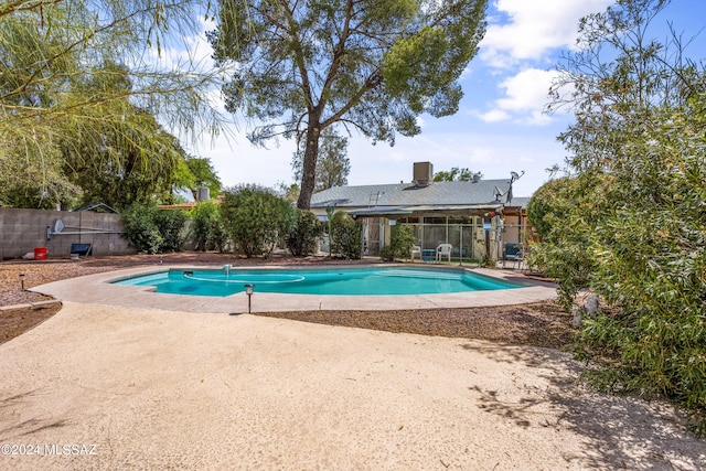 view of swimming pool with a patio