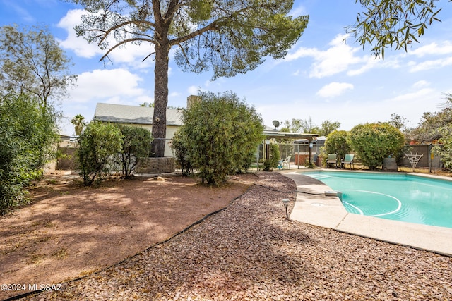 view of swimming pool with a patio area