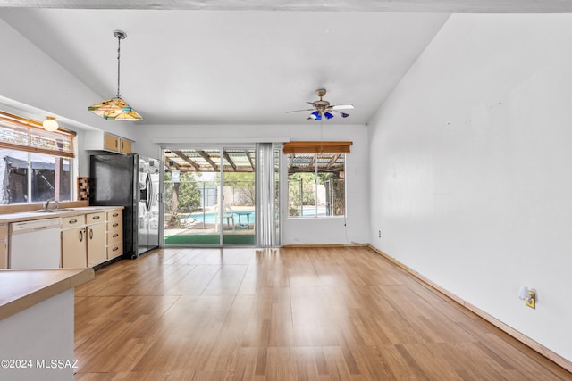 kitchen with stainless steel refrigerator with ice dispenser, ceiling fan, decorative light fixtures, dishwasher, and lofted ceiling