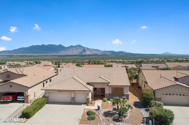 exterior space with a mountain view and a garage