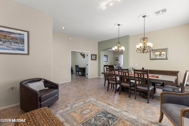 dining space featuring an inviting chandelier