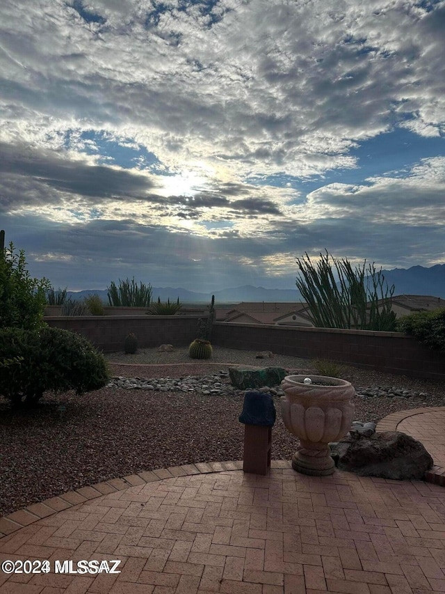 view of patio / terrace featuring a mountain view