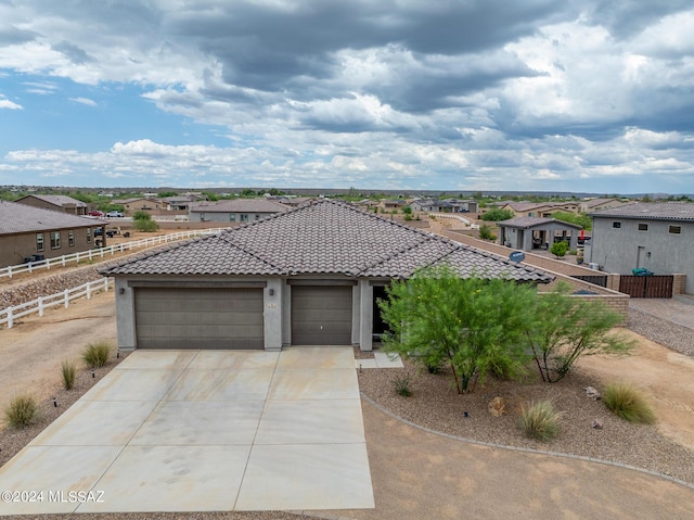 view of front of property with a garage