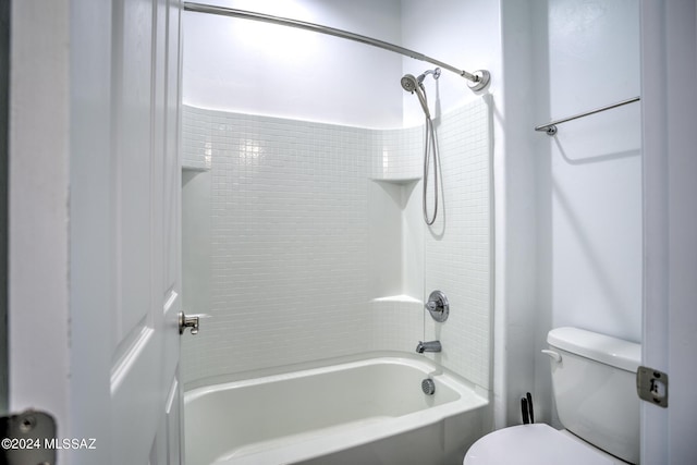 bathroom with shower / tub combination and toilet