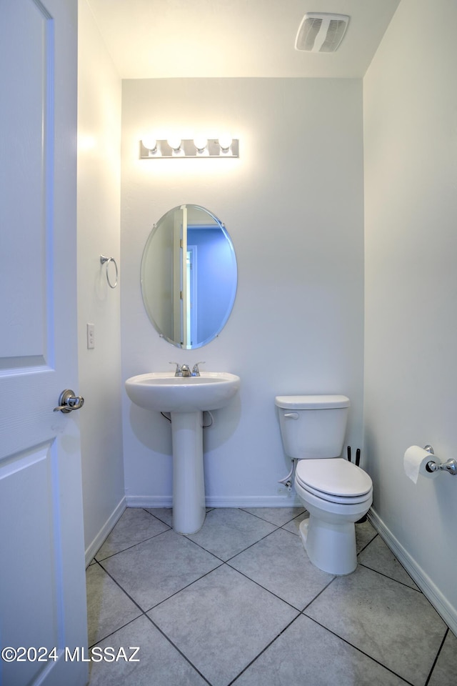 bathroom featuring tile patterned floors and toilet