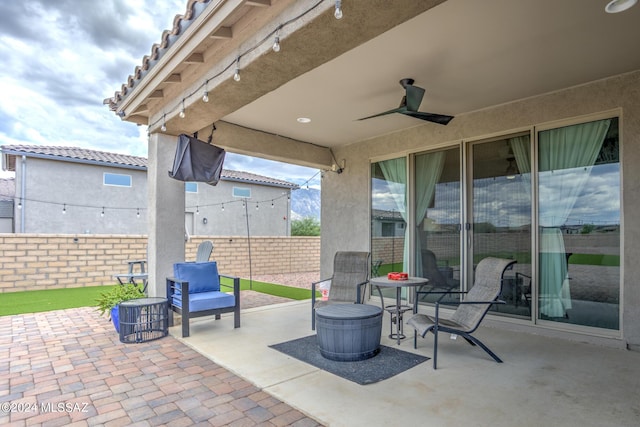 view of patio / terrace featuring ceiling fan