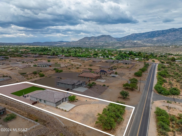 birds eye view of property with a mountain view