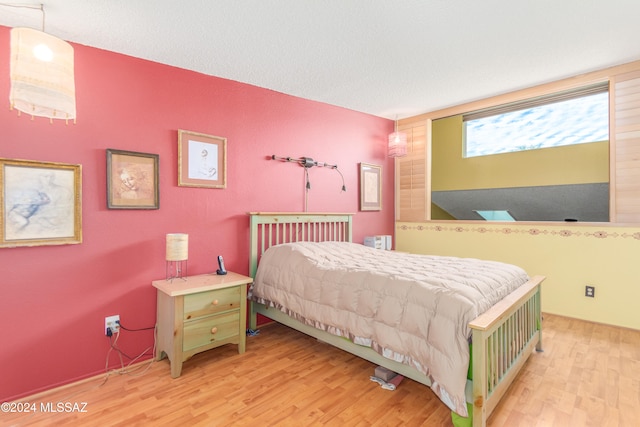 bedroom featuring light hardwood / wood-style flooring