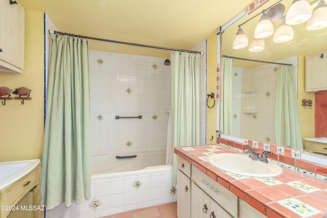 bathroom with vanity, tile patterned floors, and shower / bath combo with shower curtain