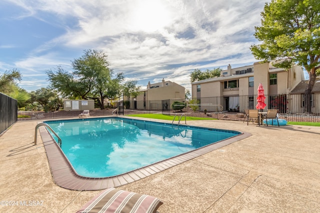 view of pool featuring a patio