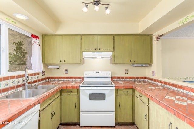 kitchen with white appliances, tasteful backsplash, tile counters, and sink