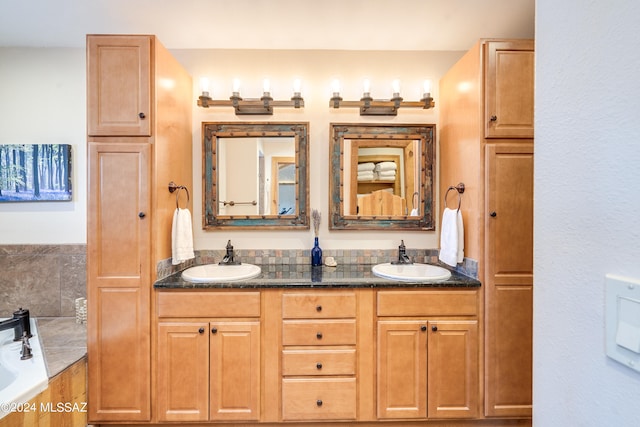 bathroom featuring vanity and a tub to relax in