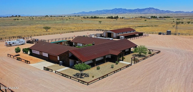 birds eye view of property with a mountain view and a rural view