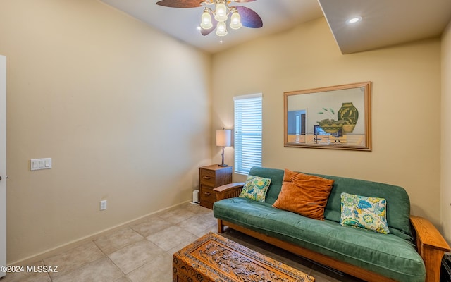 tiled living room with ceiling fan