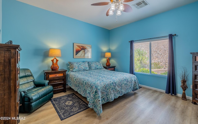 bedroom featuring ceiling fan and light hardwood / wood-style floors