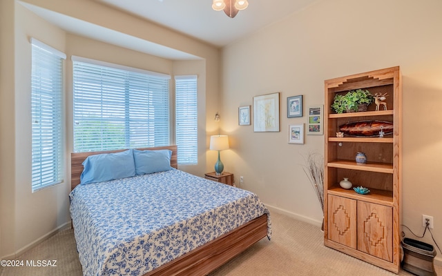 bedroom featuring light carpet