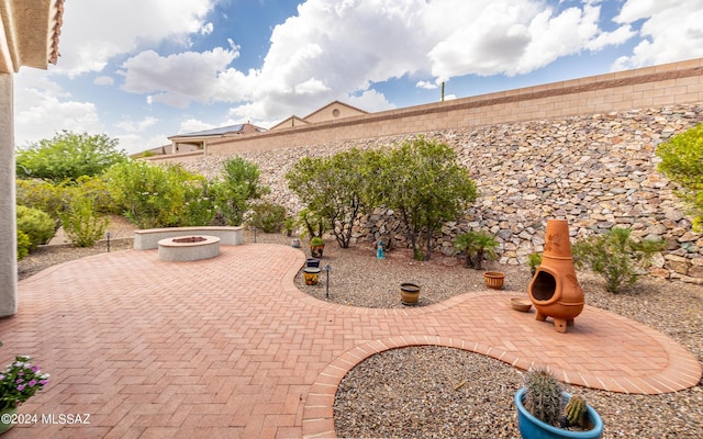 view of patio featuring a fire pit