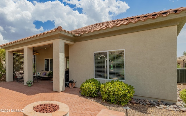 rear view of property featuring a patio