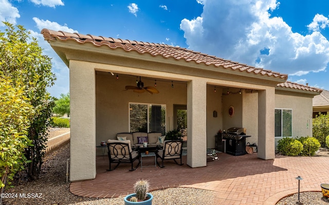 view of patio / terrace featuring ceiling fan, a grill, and an outdoor hangout area