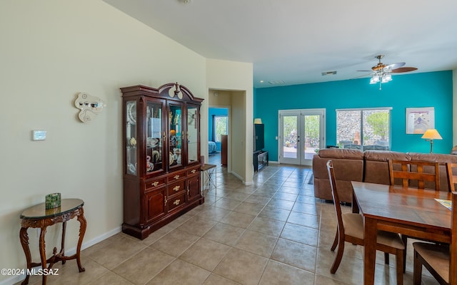 dining area featuring ceiling fan, light tile patterned floors, and french doors