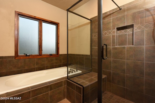 bathroom featuring plus walk in shower