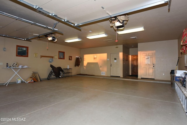 garage featuring a garage door opener