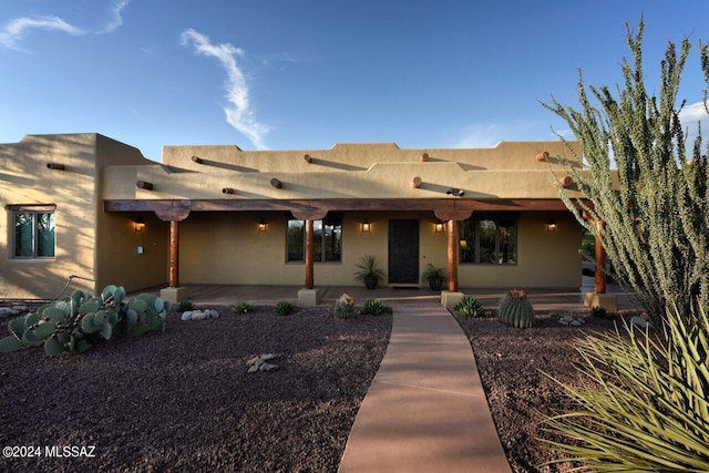 southwest-style home with ceiling fan and a patio