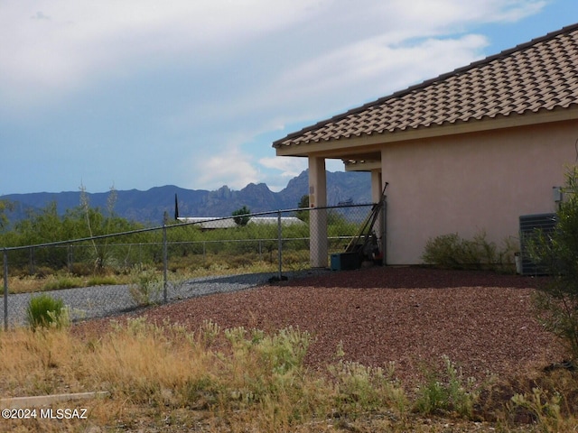 view of yard featuring cooling unit and a mountain view