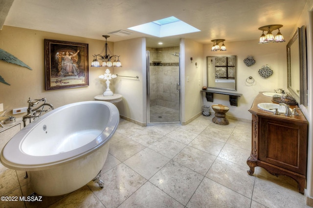 bathroom featuring shower with separate bathtub, vanity, and a skylight