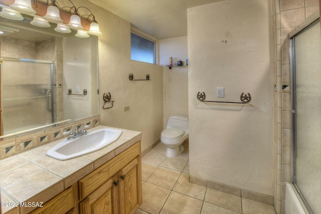 full bathroom with tile patterned floors, backsplash, toilet, shower / bath combination with glass door, and vanity