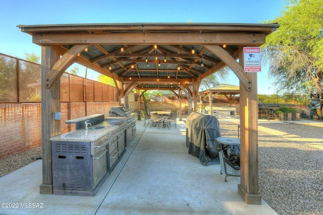 view of patio / terrace with a gazebo and a grill