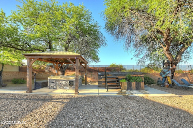 view of property's community with a gazebo and a bar