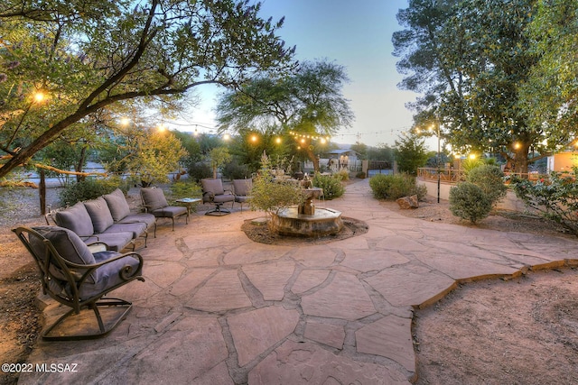 patio terrace at dusk with an outdoor living space