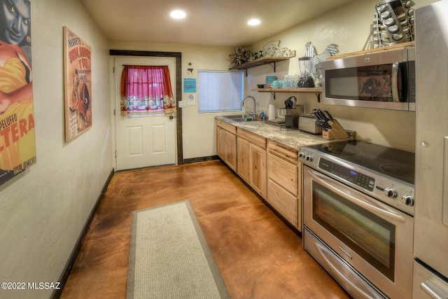 kitchen featuring light brown cabinets, sink, and stainless steel appliances