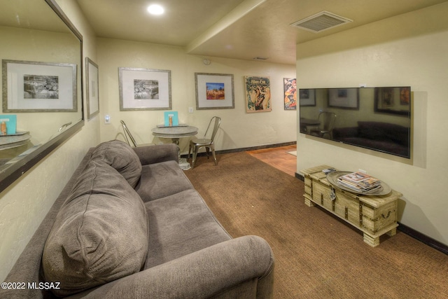 living room featuring dark carpet