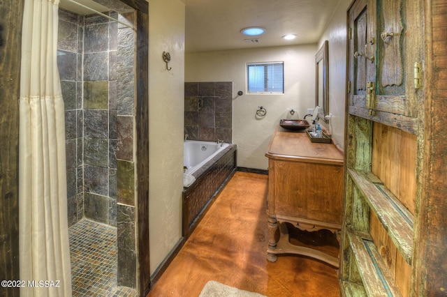 bathroom with sink and independent shower and bath