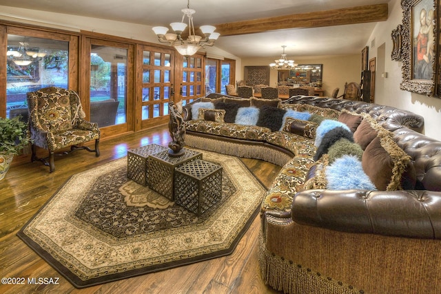 living room with a chandelier, dark hardwood / wood-style flooring, and lofted ceiling with beams