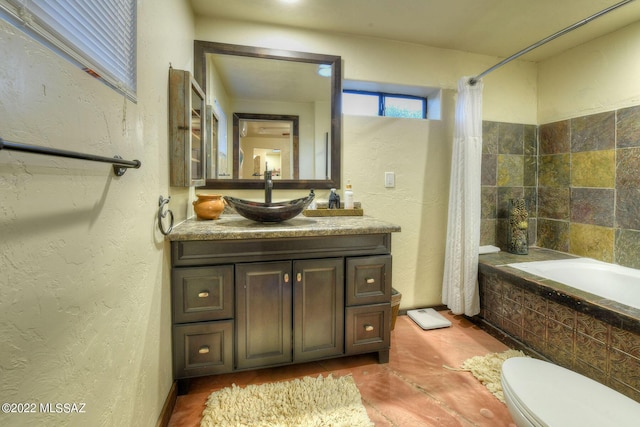 full bathroom with shower / bath combo, vanity, and toilet