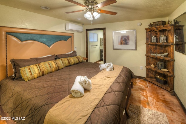 bedroom featuring a wall mounted air conditioner and ceiling fan