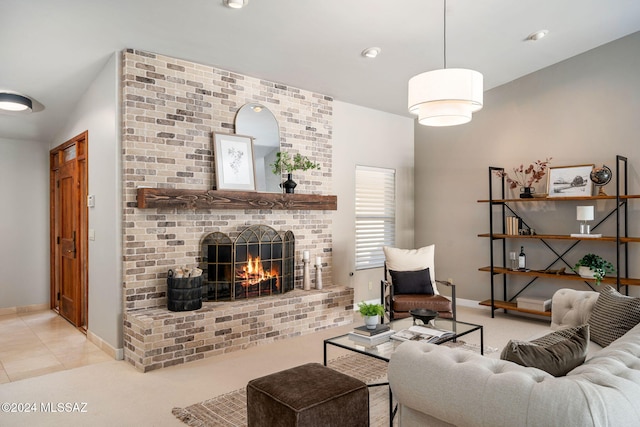 living room with a fireplace and light tile patterned floors