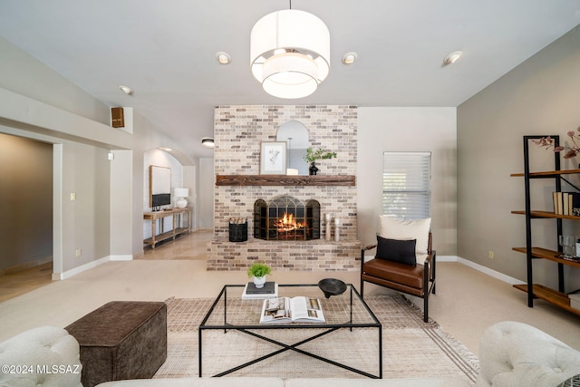 living room with a fireplace and light carpet