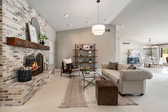 living room with light colored carpet, a fireplace, vaulted ceiling, and a notable chandelier