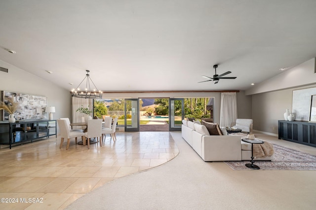 tiled living room featuring ceiling fan with notable chandelier and vaulted ceiling